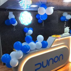 The reception desk at Punon Technologies, decorated with balloon clusters and a small Ganesha idol for an auspicious beginning.