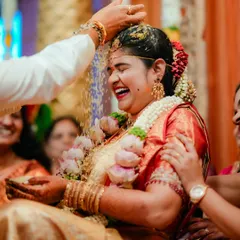 The pure, unscripted joy of a traditional Hindu wedding ceremony. I live for capturing these peak emotional moments, like the showering of rice, that you'll cherish forever.