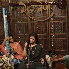 A close view of a live baithak performance, featuring Smt. Tanushree Kashyap Sharma on vocals. Our mehfils often host talented guest artists, creating a rich and varied musical experience for our audience.