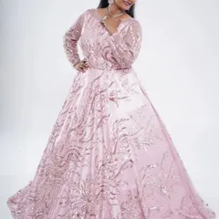 A stunning pink ball gown with intricate sequin and moti (pearl) work. This is a perfect statement piece for an engagement, reception, or a milestone birthday party.