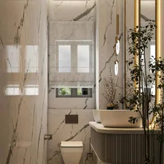 A compact yet elegant powder room design. I used floor-to-ceiling marble tiles to create a sense of height and luxury, while the wall-mounted toilet and minimalist vanity keep the floor clear and the space feeling open.
