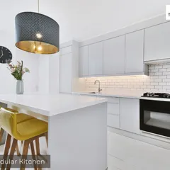 A 3D model of a modern island kitchen. This design phase allows us to plan the workflow, appliance placement, and storage solutions for maximum efficiency.