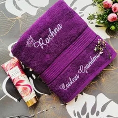 A gorgeous purple towel set, one embroidered with 'Rachna' and a crown, and the other with 'Coolest Grandma'. A perfect gift out of love and affection.
