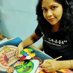 Here I am, lost in the details of a Kathakali painting. I find that focusing on the intricate patterns and colors is a form of meditation, allowing me to pour all my attention and care into the artwork.