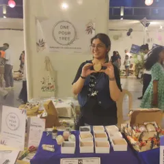 Me at the Golden Spiral School Fair, holding up a heart-shaped soap. The joy from these events is immeasurable.