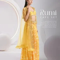 The Rumi Cape Set in a sunny yellow, featuring a knotted skirt, an embellished blouse, and an organza cape with abstract embroidery. A perfect haldi or mehendi outfit.