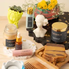 A flat lay of some of my favorite products, including skincare like body scrubs and lip balms, alongside my decor pieces. It's all about creating a complete self-care experience.