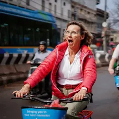 The pure, unfiltered joy of exploring a new city on a bicycle. This rider's expression of surprise and delight is why we love what we do.