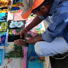 My collection of tiny paintings spread out at Chitra Santhe, attracting art admirers of all ages. These small canvases are a great way to start your art collection.