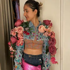 This piece explores the idea of organic fashion. I transformed a simple cropped denim jacket by adding intricate beadwork and sculptural, three-dimensional floral arrangements to the sleeves and shoulders.
