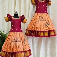 This matching Pattu Pavadai set in maroon and peach is perfect for sisters. I can create identical outfits in any size required.