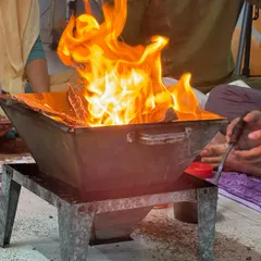 The vibrant flames of the Hawan, representing the transformative power of our shared spiritual practices.