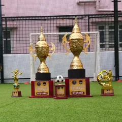 The trophies for the winners and runners-up are on display before the final match. This builds anticipation and gives players a glimpse of the prize they are competing for.