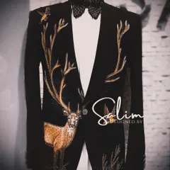 A mannequin displaying the full deer-embroidered tuxedo jacket. This view shows how the antlers spread across the shoulders, creating a stunning and symmetrical design.