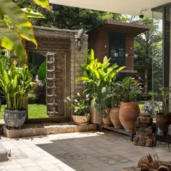 I believe in adding soul to a garden. This antique door, sourced and integrated into a modern landscape at Embassy Boulevard, acts as a stunning artistic focal point, blending history with contemporary design.