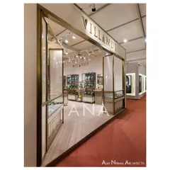 The open entrance of the Villandi booth, framed in brass, creates a seamless transition from the aisle into the retail space. The design ensures the stall feels both exclusive and accessible.
