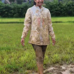 A trekker covered in mud but full of smiles after playing in the 'kesaru gadde' (mud fields). This is what pure, uninhibited fun looks like.