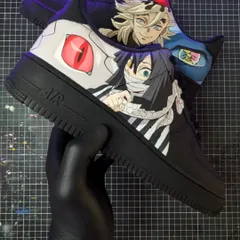 A Demon Slayer face-off between the Serpent Hashira, Obanai Iguro, and the formidable Upper Moon Two, Doma. The contrasting characters make for a dynamic design on these black AF1s.