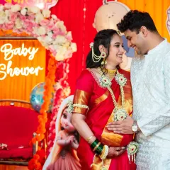 An intimate portrait of the expecting couple during their baby shower. Dressed in beautiful traditional attire, this photo highlights their connection and the blessings of the day.