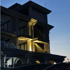 An evening shot of a resort under construction. Here, we were testing the exterior lighting design to see how it interacts with the architectural forms, ensuring a dramatic effect once completed.