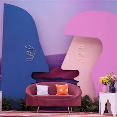 A bold and artistic seating backdrop from our 'Art in the City' carnival theme. Inspired by modern art, these abstract face silhouettes create a visually striking and interactive space for guests.