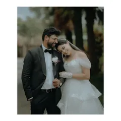 A sweet and tender portrait of Eddy and Amanda after their Christian wedding in Bangalore. The bride rests her head on the groom's shoulder, a picture of love and contentment.