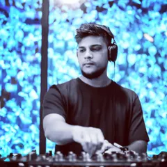 In the zone, with a cool blue visual display as the backdrop. This shot captures my focus and concentration while I'm crafting a set.