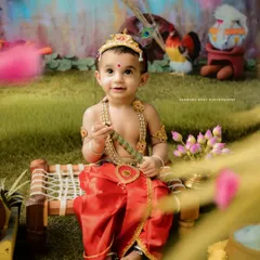 Themed photoshoots are so much fun, and this 'Little Krishna' session is a favorite among parents. I provide the complete costume and set up a vibrant, detailed backdrop to bring the story of Janmashtami to life for your child.