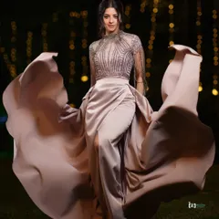 I love capturing movement and grace. This shot was taken outdoors at night, using the ambient light to highlight the flow of the gown. It’s a perfect example of a high-fashion portrait that feels alive and cinematic.