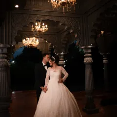 A classic, romantic portrait under magnificent chandeliers. We use dramatic lighting to create timeless images for your Christian wedding.
