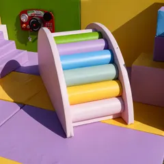 A close-up of the rainbow climber, showing the soft, rounded foam rollers that are perfect for little hands and feet.