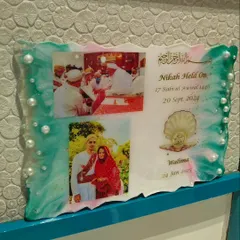 This is a resin wedding invitation I created. It's a unique way to announce your special day and give your guests a beautiful memento that won't get thrown away, featuring your photos, dates, and decorated with pearls and custom colors.