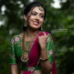 This side profile highlights the soft, romantic hairstyle that complements the modern lehenga. We teach a variety of contemporary hairstyles that work beautifully with modern Indian wear.