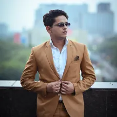 This is a tighter, mid-length shot from the same series. It brings the focus to the subject's expression and the fit of the jacket, offering a different perspective for a professional portfolio.