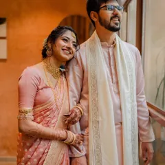 A vibrant varmaala ceremony with colorful smoke, creating a truly spectacular and modern moment. We love capturing both the tradition and the unique personality of your wedding.