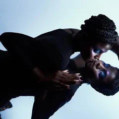 A conceptual shot using a mirror to create a "two-faced" illusion. The pose, with the model kissing her own reflection, explores themes of self-love and identity.
