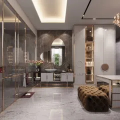 We designed this washroom and walk-in closet to be both stylish and functional. The space features an asymmetrical mirror, a fluted vanity with gold accents, and a central island with a tufted ottoman for a luxurious dressing experience.