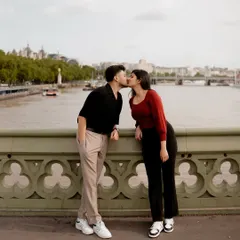 A kiss on a London bridge, with the city's iconic skyline as a witness. For Devi and Milind, I captured their love story in the city where it blossomed, showing that I am ready to travel anywhere your story takes me.