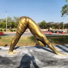 This life-size statue is part of a Surya Namaskar series, finished in a classic gold metallic look. We craft these dynamic yoga pose sculptures for gardens, wellness centers, and public parks, creating a sense of peace and movement.