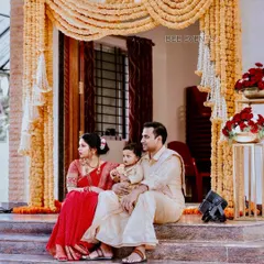 A lovely family portrait from a naming ceremony we organized. The backdrop of traditional marigold hangings adds a warm and auspicious touch to this beautiful moment.