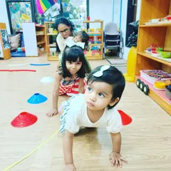 Even our littlest members get in on the action! Crawling is a fundamental movement that strengthens the whole body. These toddlers are building a strong foundation for walking, running, and jumping.