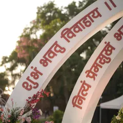 A close-up of the custom-printed Sanskrit verses on the mandap arch. Every detail was designed with intention to infuse the ceremony with meaning and tradition.