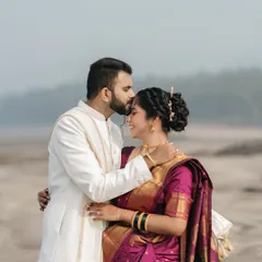 A tender forehead kiss against the serene backdrop of the sea. This shot captures a quiet promise, showcasing our ability to create deeply emotional portraits during destination weddings.
