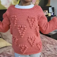 This cozy bobble-stitch heart sweater was one of the first big projects I made for my daughter. Crafted with incredibly soft yarn, it’s designed to be a warm hug she can wear. It’s a reminder of where my journey began and the love that’s woven into every stitch.