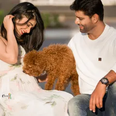 A sweet moment as the couple's poodle joins the maternity shoot. I believe pets are family and love including them in these special memories.