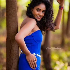Her vibrant personality and amazing curls were the stars of this shoot. We found a spot in the woods where the light was just right to capture her bright smile and confident energy.