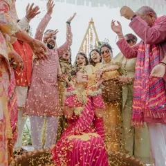 A moment of pure bliss as the bride is showered with flower petals by her loved ones. We aim to freeze these moments of overwhelming joy and celebration.