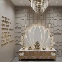 We created a unique focal point in this pooja space with a large, backlit lotus flower design. The Gayatri Mantra is engraved in elegant gold lettering on the wall, complemented by a modern chandelier and a custom cabinet with a subtle floral print.