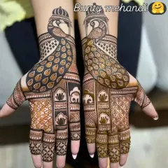 A bold and beautiful design where two peacocks face each other across the palms, their feathers forming an intricate pattern. The dark stain makes the design pop.