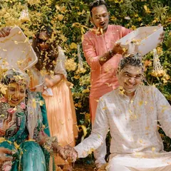 A fun-filled 'phoolon ki holi' during the Haldi ceremony. I love capturing these moments of pure, uninhibited joy as the couple is showered with flower petals.